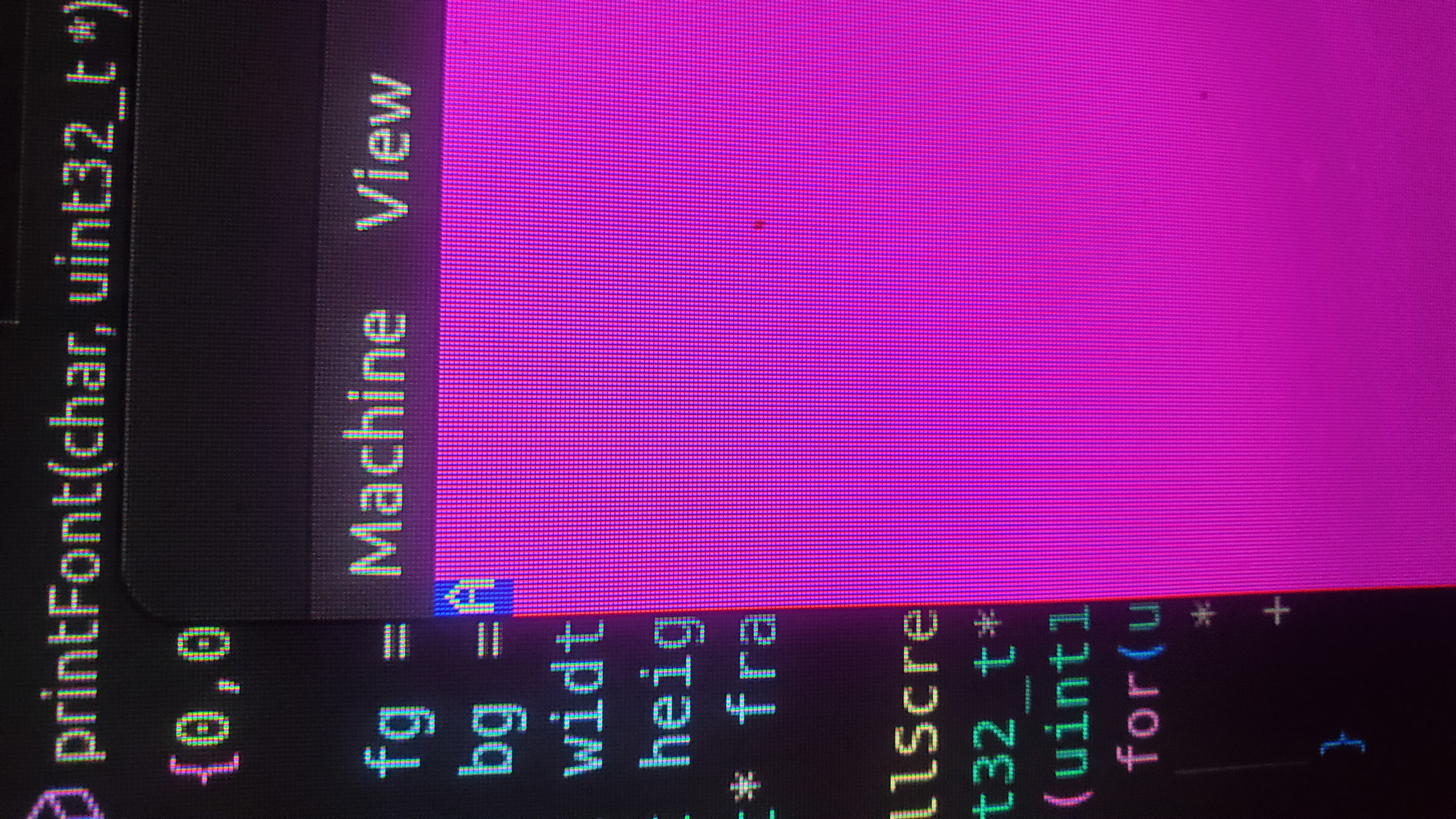 A picture of a computer screen showing a white capital A on a blue background, surrounded by magenta.
